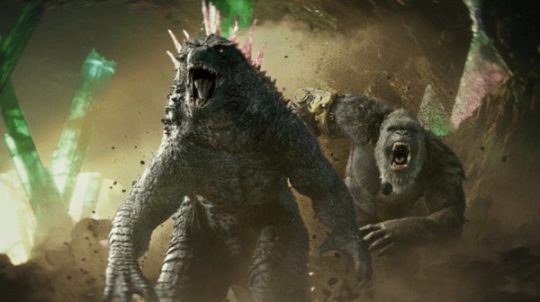 King Kong stands behind Godzilla and is roaring in anger 