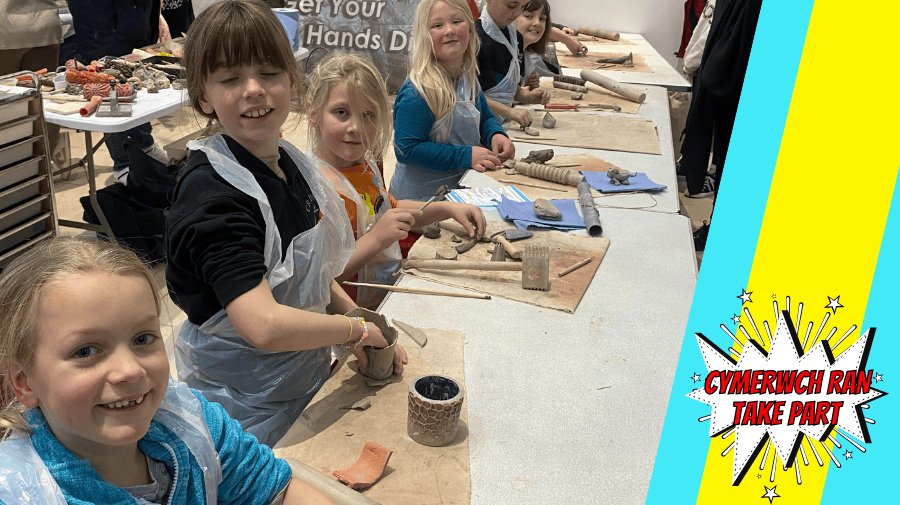 a group of children making clay cups 