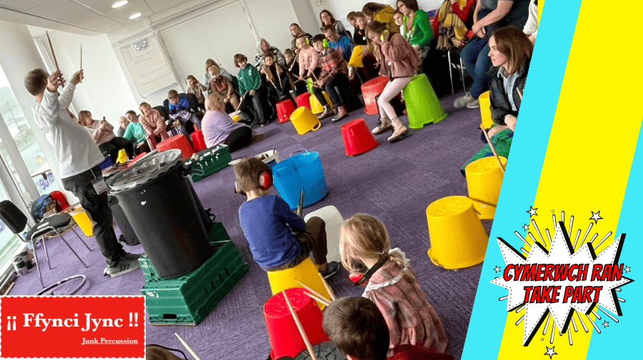 a group of chidren and adults using plastic objects as percussion 